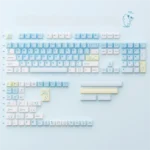 Whimsical Summer Kitty PBT Dye-Sub 149-Key Set, featuring bright, playful cat designs and subtle transparent accents for a charming desktop.