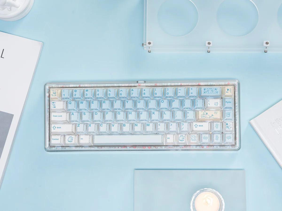 Playful Summer Kitty PBT Dye-Sub keycap set with unique refraction translucent keys, featuring bright, whimsical cat designs for a lively desktop.