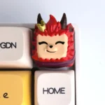 This handcrafted Mischievous Devil Teemo resin gaming keycap for ESC is shown from a unique angle, highlighting its vibrant colors and intricate detail.