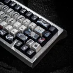 Thor's Thunderous Might 142-key mechanical keycap set. Dynamic Mjolnir and lightning motifs from a distinct angle, emphasizing its premium, powerful spirit.