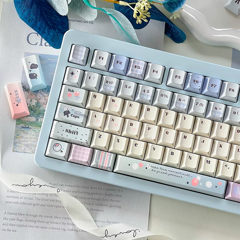 Close-up of Dreamy Tipsy Bubbles PBT Dye-Sub Keycaps set, showcasing delicate pastel gradients and ethereal bubble patterns from a top-down artistic angle.