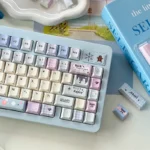 Artistic shot of Dreamy Tipsy Bubbles PBT Dye-Sub Keycaps Set, highlighting their soft pastel gradients and whimsical bubble designs for a unique keyboard.