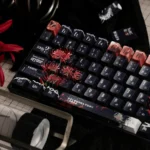 Artistic shot of Tokyo Ghoul Ken Kaneki side-printed PBT keycaps set, highlighting the unique shine-through legends from multiple angles.
