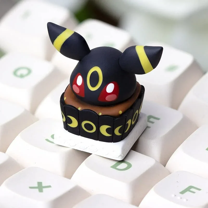 Charming handcrafted Umbreon 'Cake' artisan keycap, a meticulously sculpted Pokemon design with a sweet, cake-inspired aesthetic, perfect for ESC key.