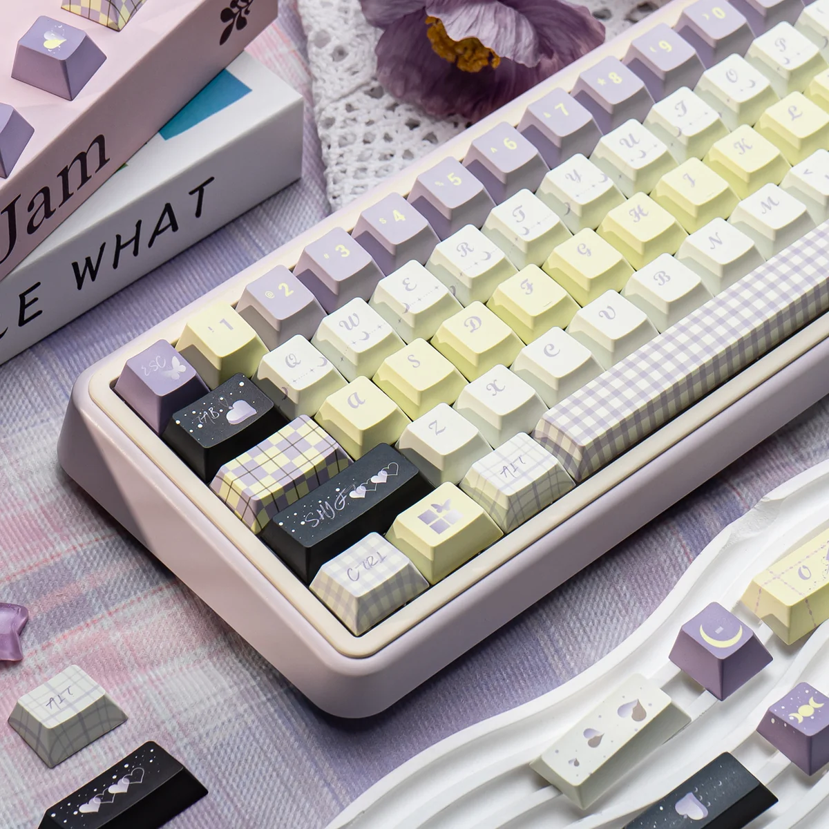 A collection of durable PBT keycaps from the Unforgettable Moments Cherry profile set, elegantly displayed from multiple angles to highlight their soft design.