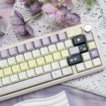 An elegant close-up of the Unforgettable Moments PBT Keycap Set, highlighting its durable PBT construction and soft, nostalgic design in Cherry profile.