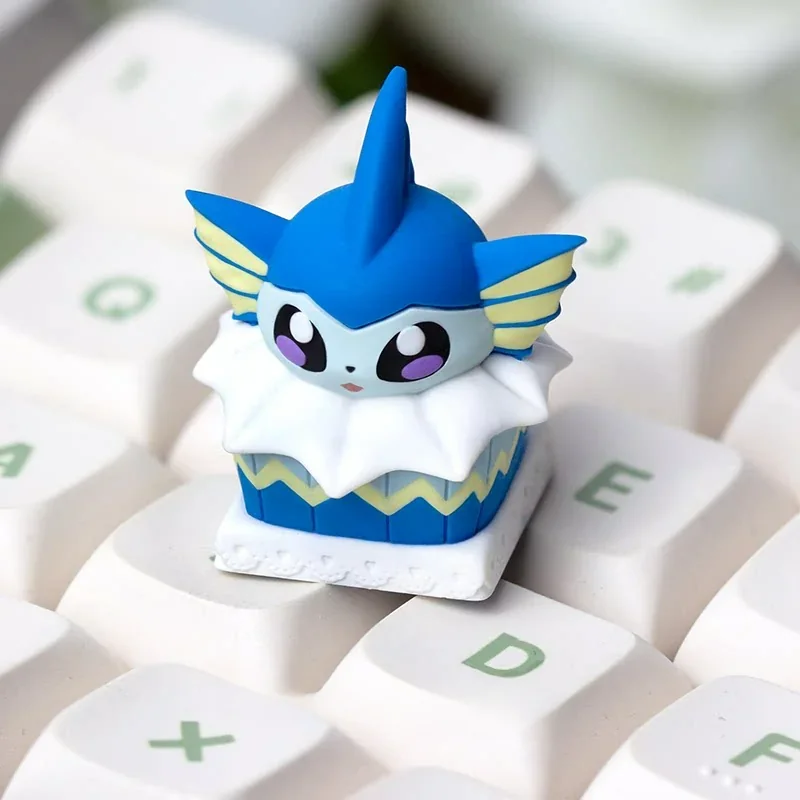 Handcrafted Vaporeon 'Cake' artisan keycap, showcasing a whimsical design with soft pastel hues, perfect as a charming collectible.