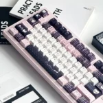 Close-up of whimsical rabbit glitter PBT keycaps set showing intricate hand-painted princess hues details and sparkling accents.
