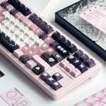 Close-up of a whimsical hand-painted rabbit princess PBT keycap set, showcasing its unique glitter and intricate artistic details from a unique angle.