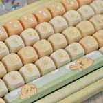 Charming Usagi PBT MOA artisan keycap set shown from multiple angles, highlighting its whimsical Japanese rabbit design and unique profile.