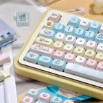 Serene Winter PBT Keycap Set, different angle. Durable PBT, crisp dye-sub legends. Artistic cool winter landscape; calm, elegant aesthetics.