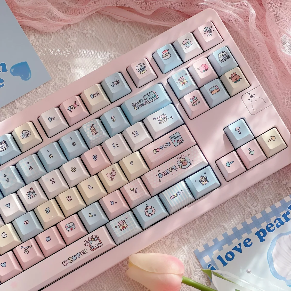 Close-up of Serene Winter PBT keycaps set, highlighting crisp dye-sub legends and durable PBT texture. Artistic cool hues evoke a calm winter serene.