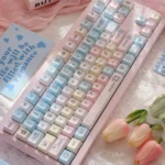 Detailed view of the 145-key Serene Winter PBT keycap set, showcasing durable dye-sub legends in cool hues, capturing an artistic design.