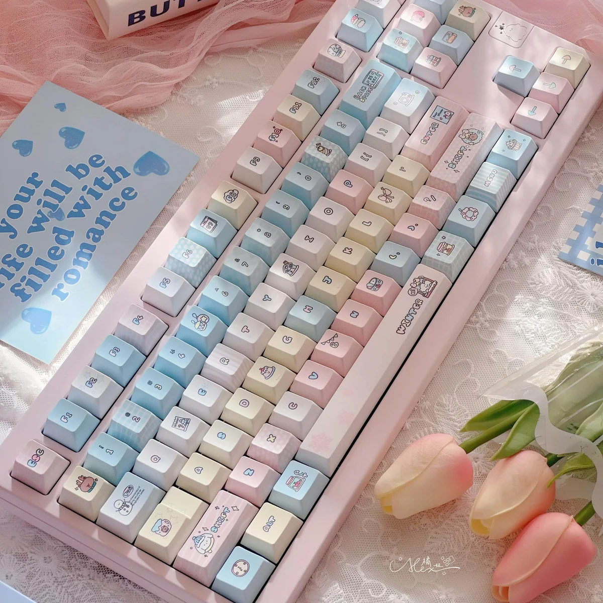 Detailed view of the 145-key Serene Winter PBT keycap set, showcasing durable dye-sub legends in cool hues, capturing an artistic design.