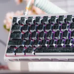 Detailed views of the Ancient Beast Cherry Keycap Set, featuring multiple ancient beast designs sculpted in premium metallic paint, highlighting their intricate artistic design.