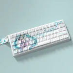 Exclusive Hatsune Miku PBT dye-sub keycaps set for keyboards, showcasing vibrant teal and art with a side-lit design from a new angle.