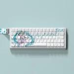 Exclusive Hatsune Miku PBT dye-sub keycaps set for mechanical keyboards, featuring vibrant teal and digital pop art and a playful side-lit design.