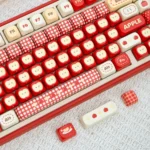 Apple UR82 tri-mode mechanical keyboard in playful Apple design. Gallery shows its ergonomic, compact design and vibrant RGB lighting from all angle.