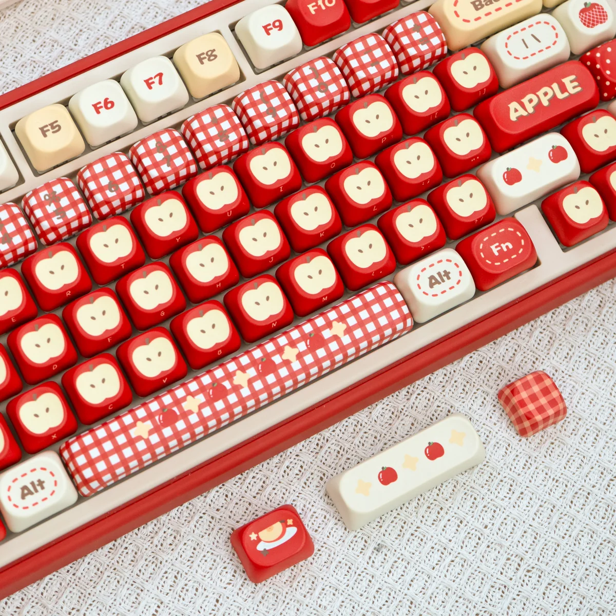 Apple UR82 tri-mode mechanical keyboard in playful Apple design. Gallery shows its ergonomic, compact design and vibrant RGB lighting from all angle.