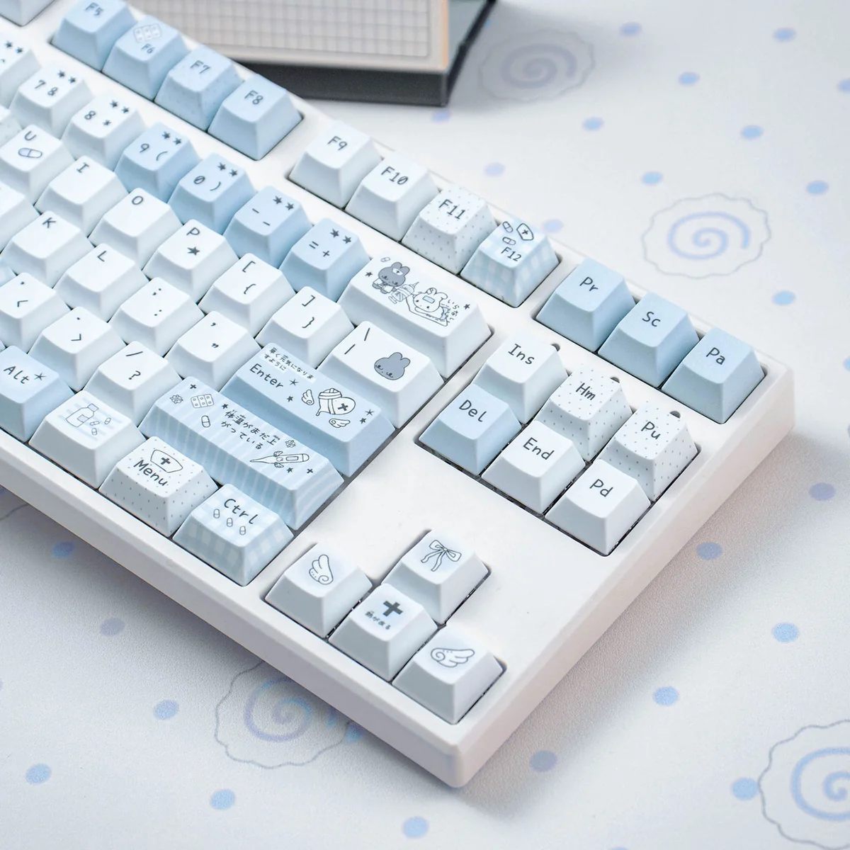 Aqua Diary PBT Cherry keycaps set showcasing their serene watercolor aesthetic with soft aqua and pastel tones, emphasizing durable PBT and comfortable profile setup.
