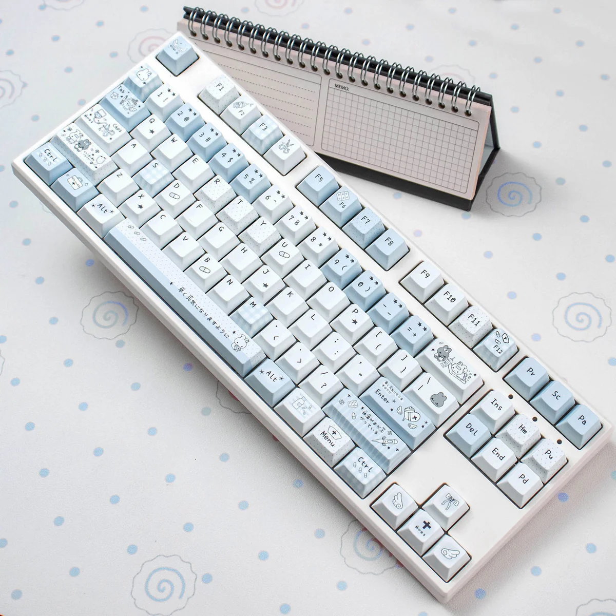 Aqua Diary PBT Cherry keycaps set displayed in a product gallery, revealing serene watercolor pastel designs, soft aqua hues, and durable construction.