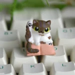 Artisan Cat Keycap for ESC, a handcrafted whimsical cat cleaning design. Various angles reveal its unique cat theme, vibrant resin, and playful detail.