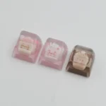 A playful, handcrafted resin animal sundae artisan ESC keycap, shown from multiple angles to highlight its vibrant colors and charming, intricate design.