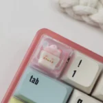 Whimsical animal sundae artisan keycap. Handcrafted resin, vibrant colors, and intricate dessert details shown from various playful angles.