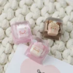 Charming close-up of a handcrafted resin animal sundae artisan keycap, featuring a whimsical design with vibrant colors and sweet details.