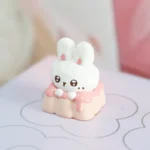 Close-up view of the handcrafted Fabu Rabbit Strawberry Pudding resin artisan keycap, showcasing its whimsical pastel colors and adorable rabbit design.