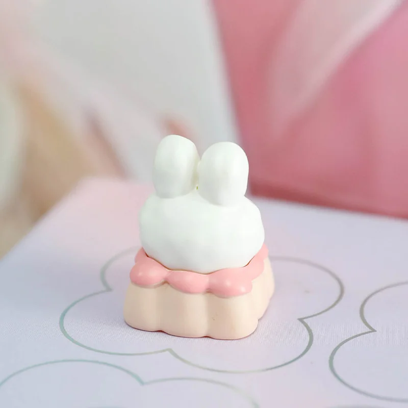 A delightful close-up of the handcrafted Fabu Rabbit Strawberry Pudding resin artisan keycap, highlighting its whimsical pastel dessert theme.