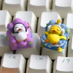 A detailed view of the whimsical handcrafted Lying Flat Duck Artisan Resin ESC Keycap, highlighting its unique design and vibrant resin from a different angle.