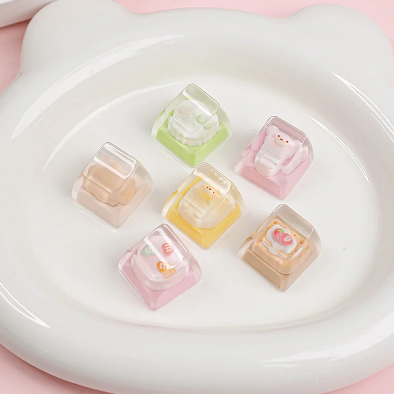 A whimsical handcrafted resin artisan keycap, featuring playful melon and star dessert details, captured from a unique angle.