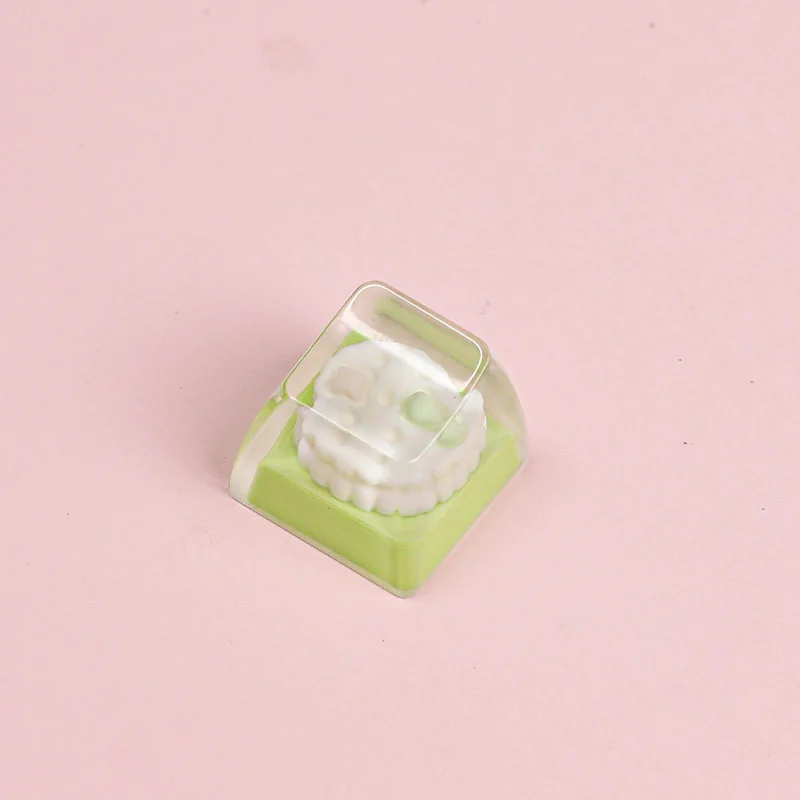 Whimsical handcrafted resin artisan keycap showcasing a cute melon and star dessert design, adding a unique, playful accent to any keyboard.