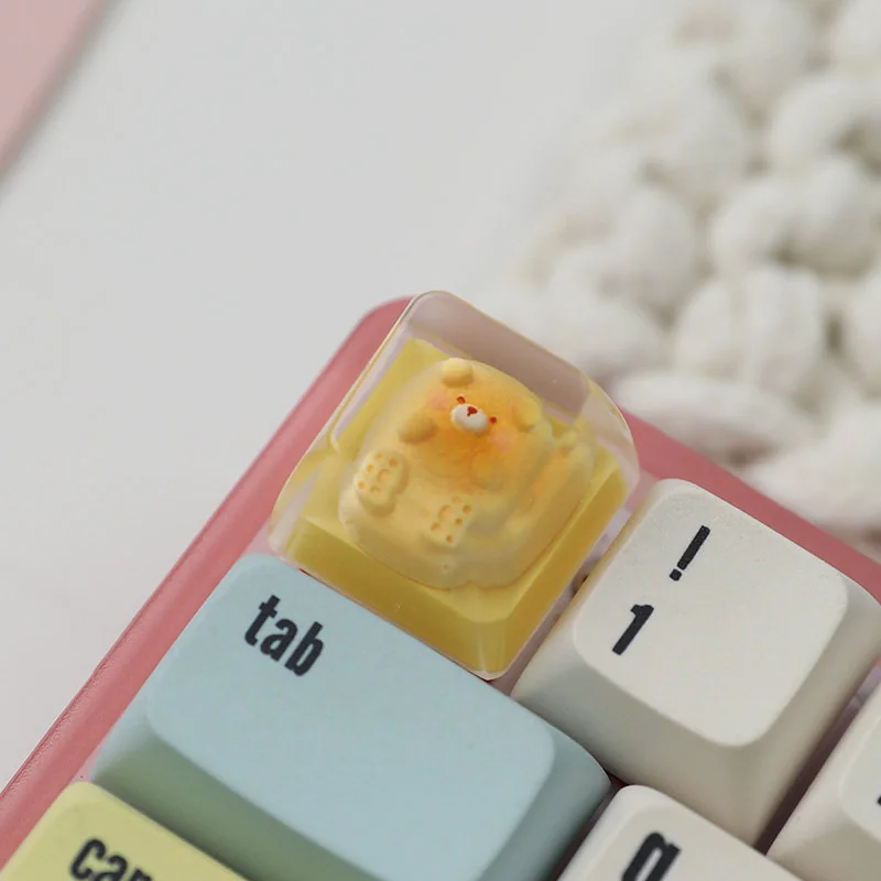 Close-up of a Bear Bread Transparent Keycaps, showcasing its adorable miniature bear shape and vibrant pastry details.