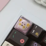 Mini Rice Dog Transparent Keycap, handcrafted with a glossy finish, featuring a whimsical miniature dog design for keyboards.