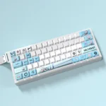 Playful Valorant Jett PBT keycaps set for gaming, showcasing dynamic blue and white wind motifs from multiple angles, perfect for RGB keyboards.