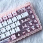 Close-up of a charming PBT keycap set from the Whimsical Bear Tea Party set, showcasing pastel colors and an adorable illustrated bear enjoying a tea party design.