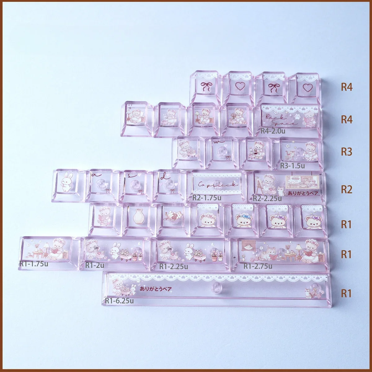 Whimsical Bear Tea Party PBT keycaps set close-up, revealing charming pastel illustrated bears and tea party elements. Durable PBT set for a joyful, playful design.