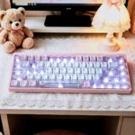 Whimsical Bear Tea Party PBT Keycaps set on a joyful pastel desk, featuring charming illustrated bears enjoying a tea party. Durable PBT material.