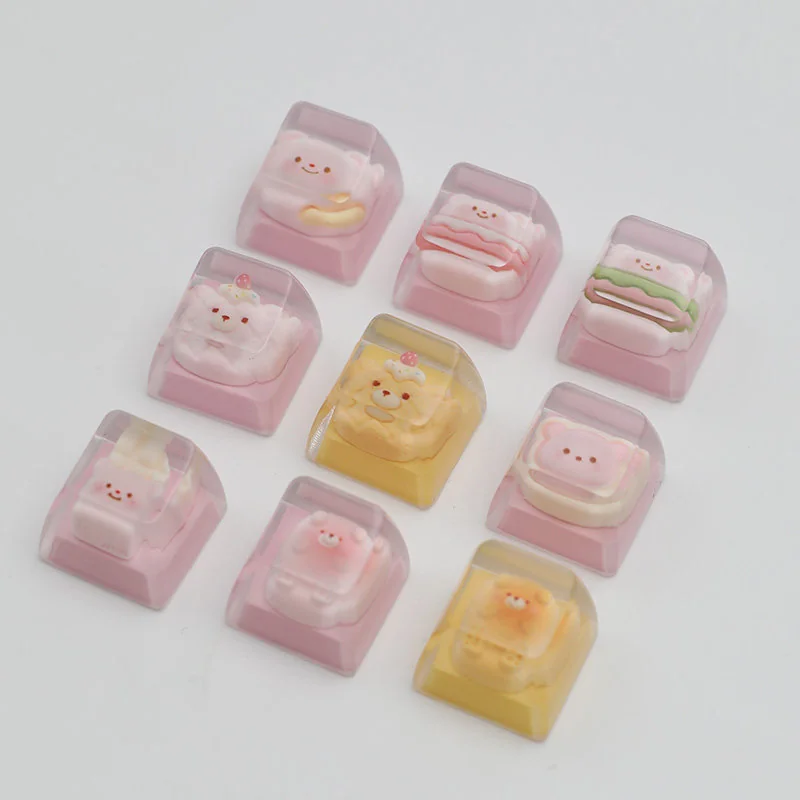 Birthday Bear Waffle Transparent Keycaps shown from multiple angles, featuring an adorable bear with colorful dessert detail.