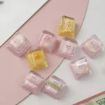 A Birthday Bear Waffle Transparent Keycaps, meticulously handcrafted from resin, showcasing its adorable dessert theme and vibrant colors.