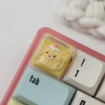 Close-up of a Birthday Bear Waffle Transparent Keycaps for ESC, handcrafted from colorful resin, showcasing its delightful dessert theme from multiple angles.