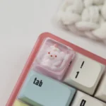 Detailed side view of the Birthday Bear Waffle Transparent Keycaps, highlighting the handcrafted resin bear with its playful waffle and vibrant dessert, a unique setup.