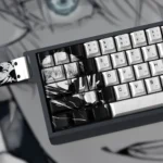 Invincible Power Gojo Satoru PBT dye-sub keycaps set, displayed from a dynamic angle, highlighting their iconic design and sophisticated grey aesthet