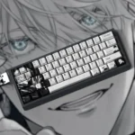 Close-up of the exclusive Gojo Satoru PBT Dye-Sub keycaps from multiple angles, showcasing the sophisticated grey palette and iconic character design