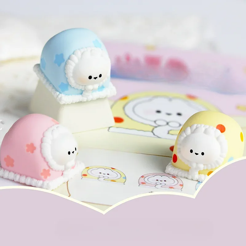 Artistic collection of Blanket rabbit artisan keycaps, highlighting the handcrafted resin artistry and intricate seasonal character design from multiple angles.