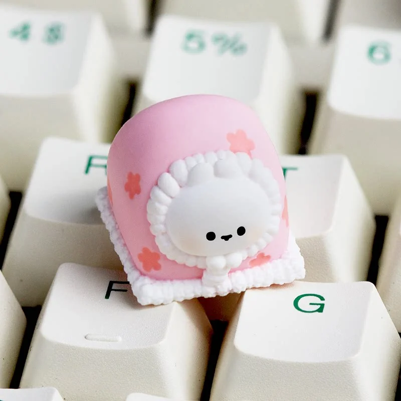 Close-up views of a Blanket rabbit handcrafted resin artisan keycap, showcasing intricate seasonal details and its unique artistic finish.