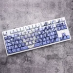 Blue backlit side-engraved PBT keycaps from many angles, highlighting durability, clear legends, and ergonomic Cherry profile.