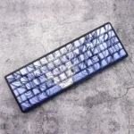 A gallery of blue backlit side-engraved durable PBT keycaps, showcasing their clean aesthetic, ergonomic Cherry profile, and transparent legends from multiple angles.